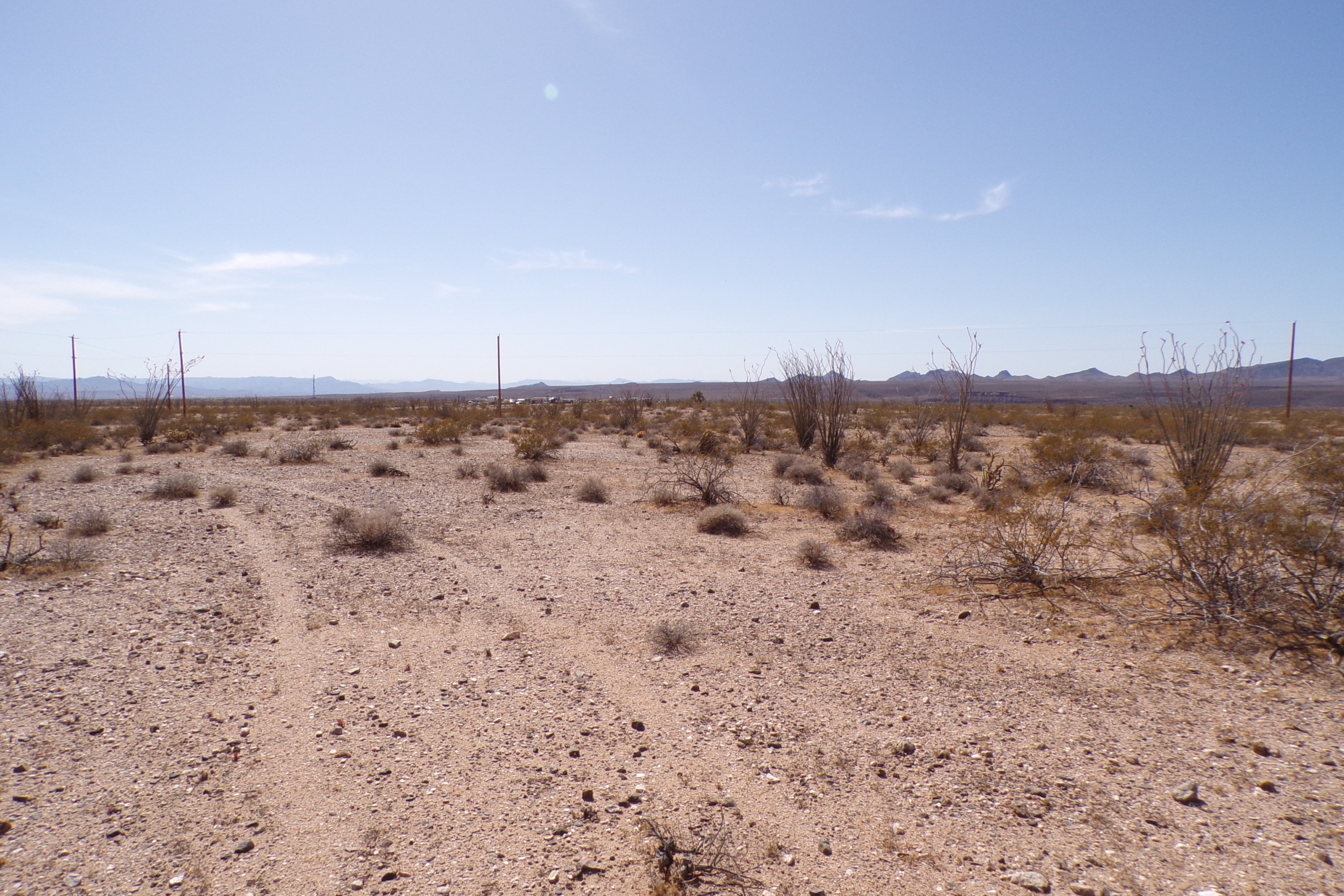 Convenient Tri-State Location! 1 Acre with Electricity Access! Yucca, AZ.